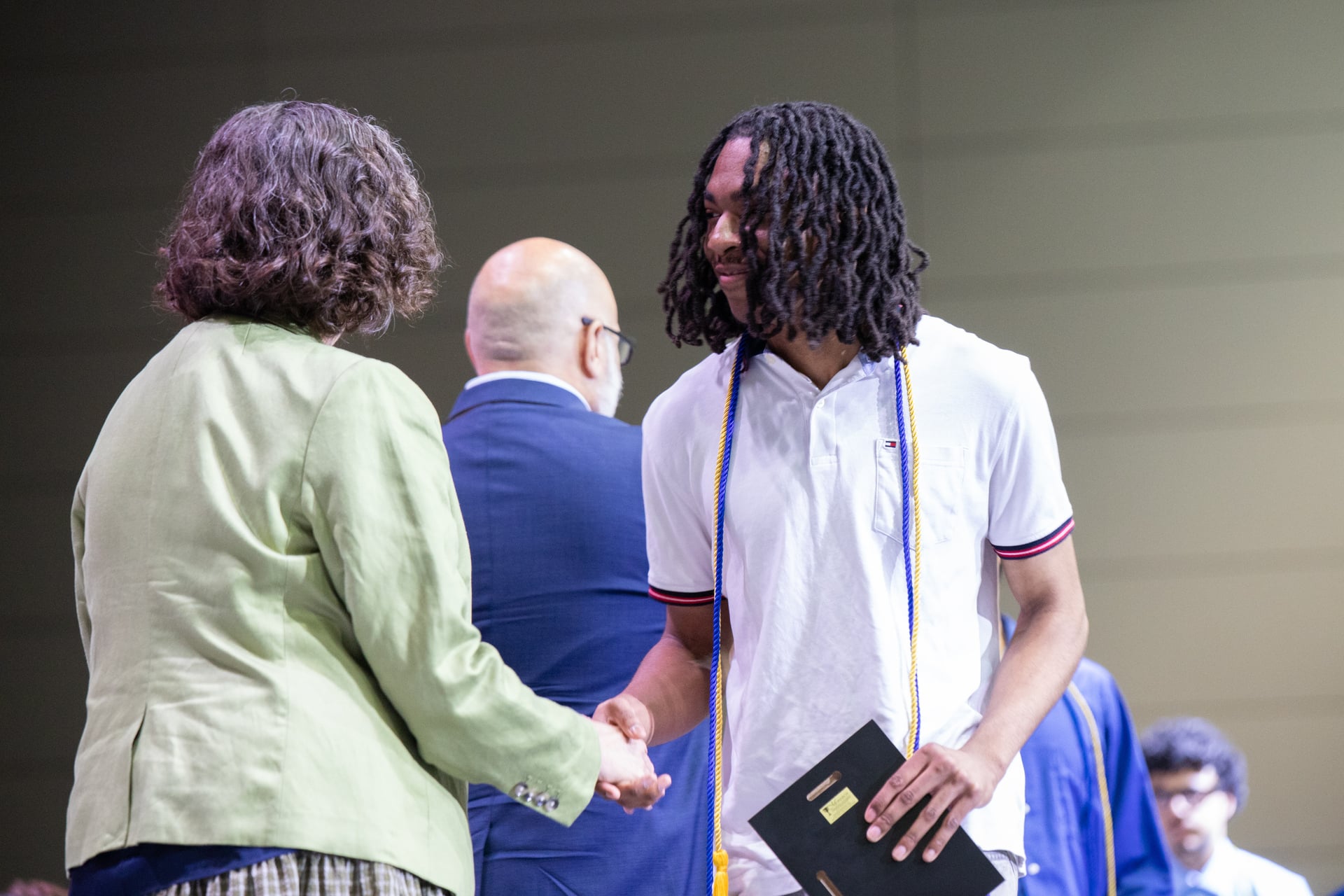 Graduate receiving diploma
