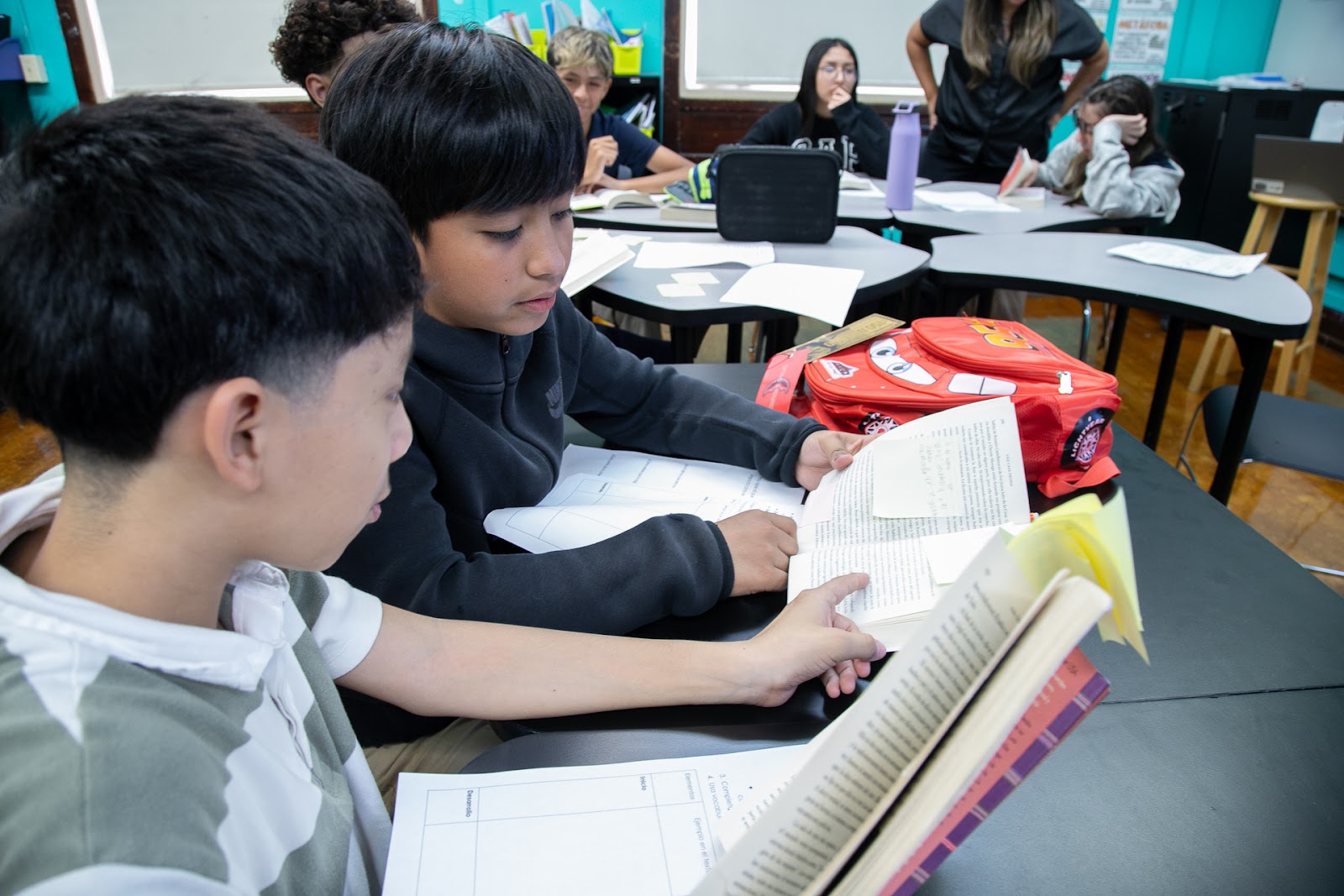 Students looking at a book