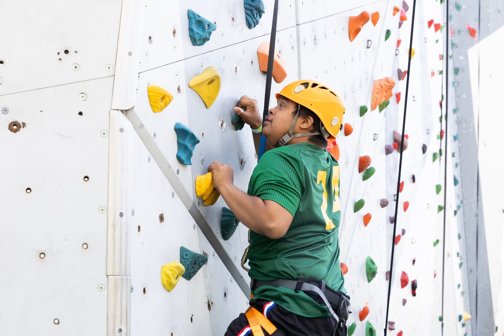 student doing rock-climbing