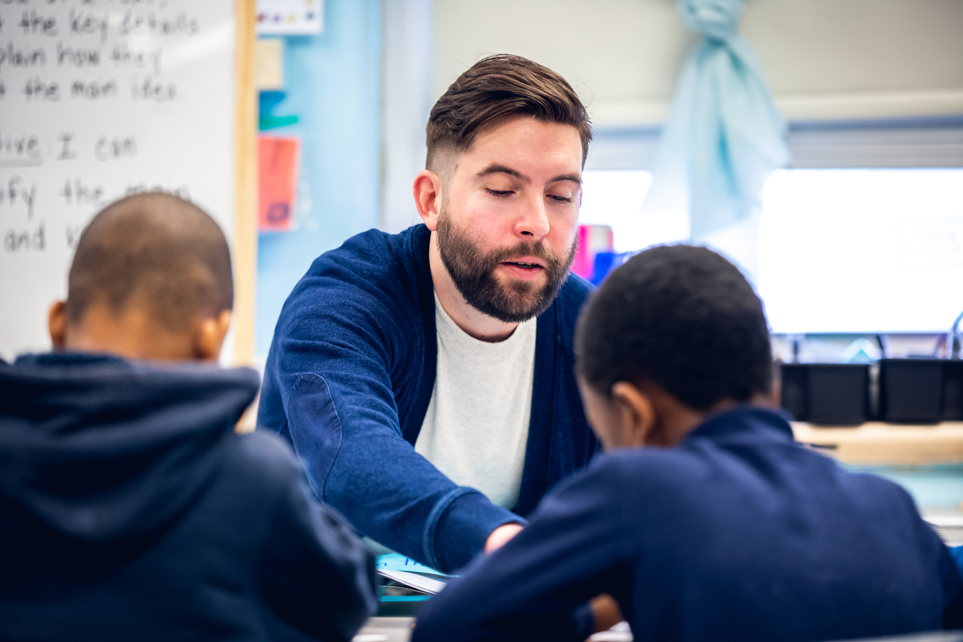 Teacher working with students