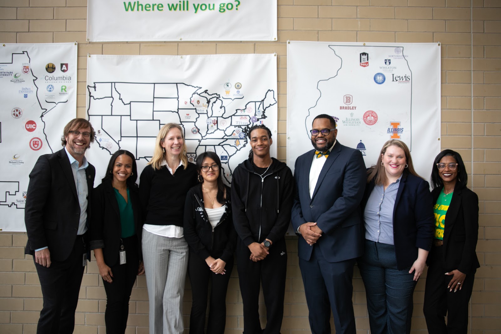 teachers standing by a map
