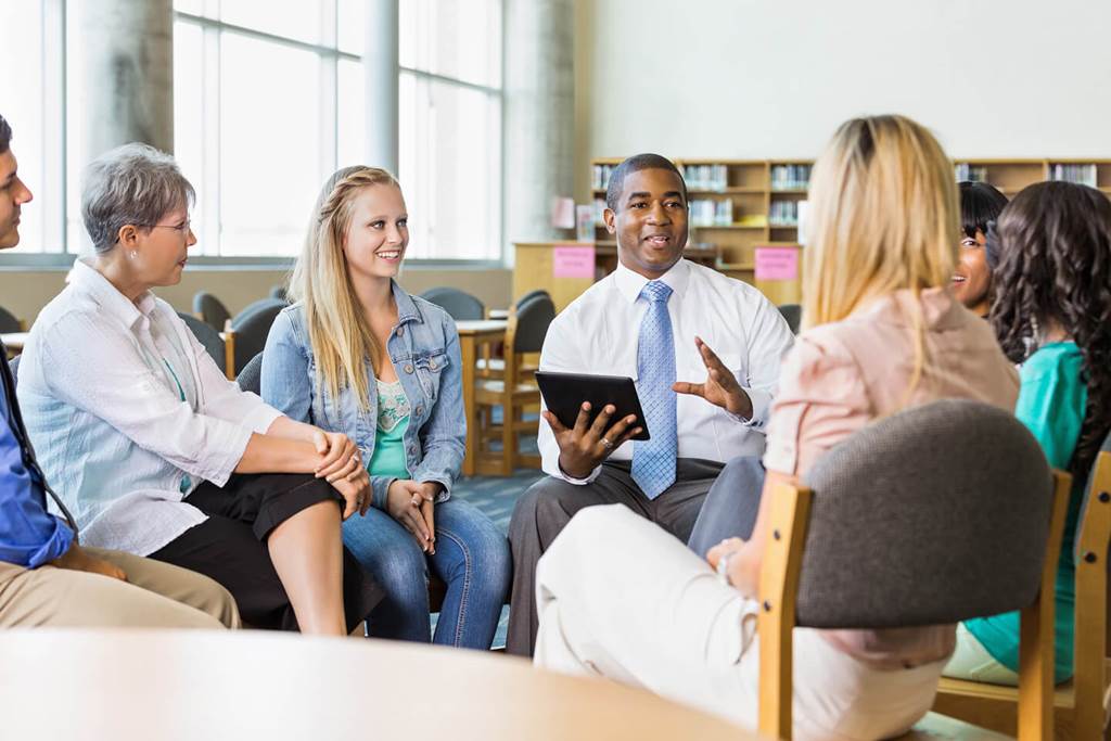 people sitting together talking