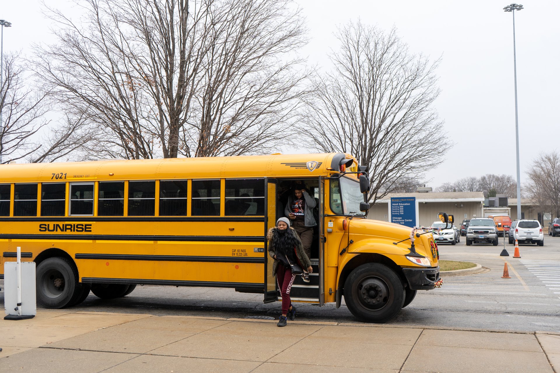 students coming off school bus