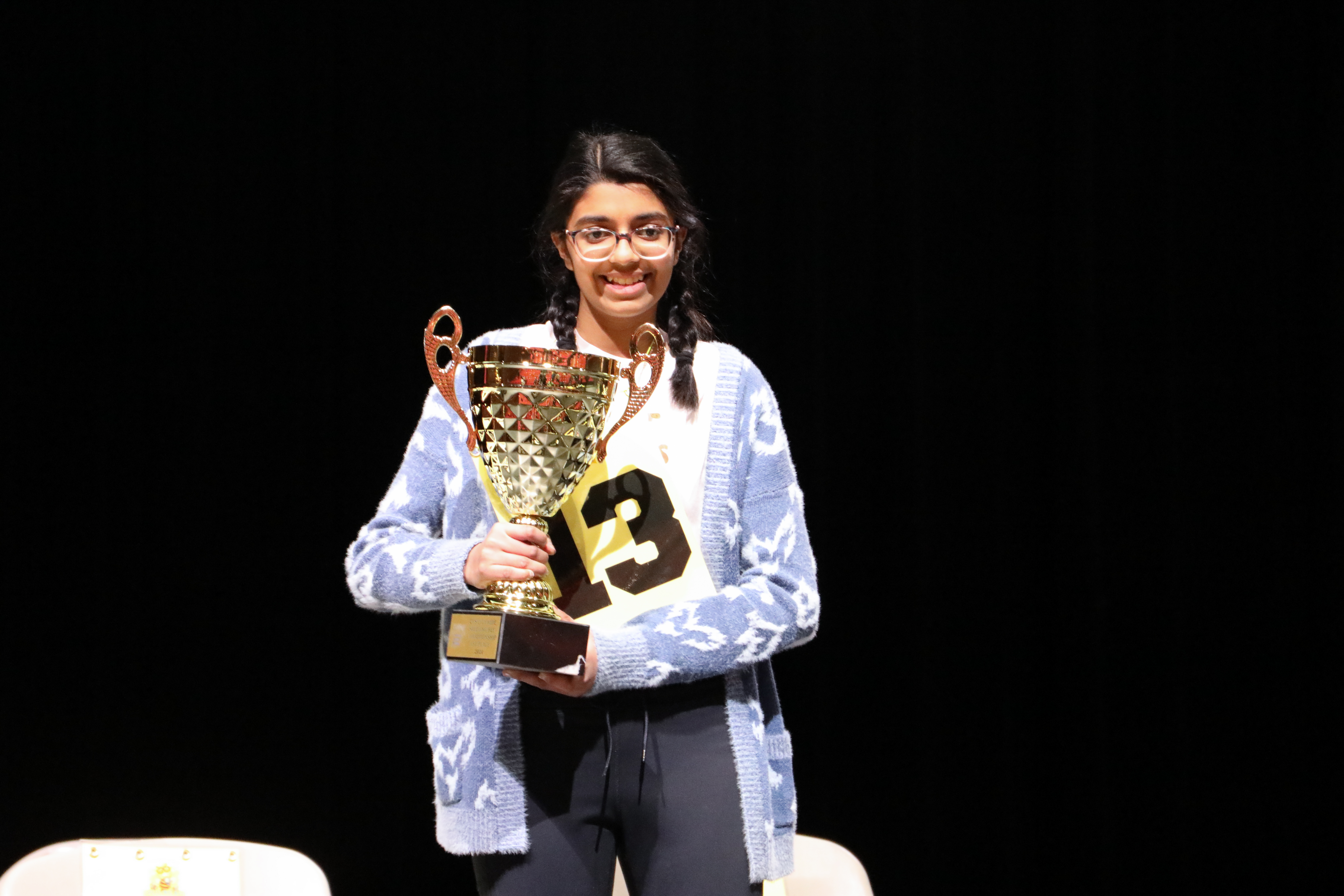 Nidhi with the Citywide Spelling Bee trophy
