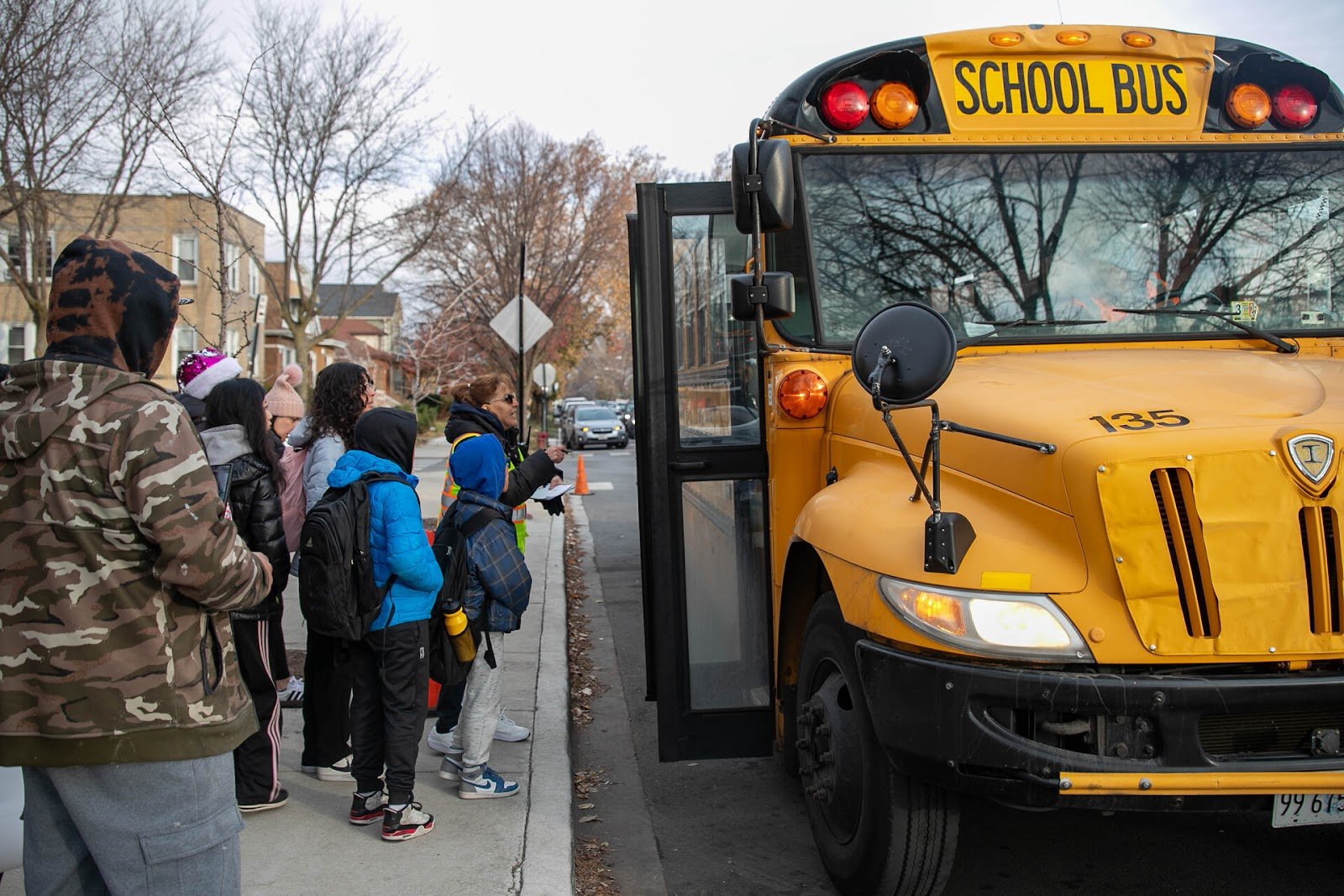 Children getting on a school bus