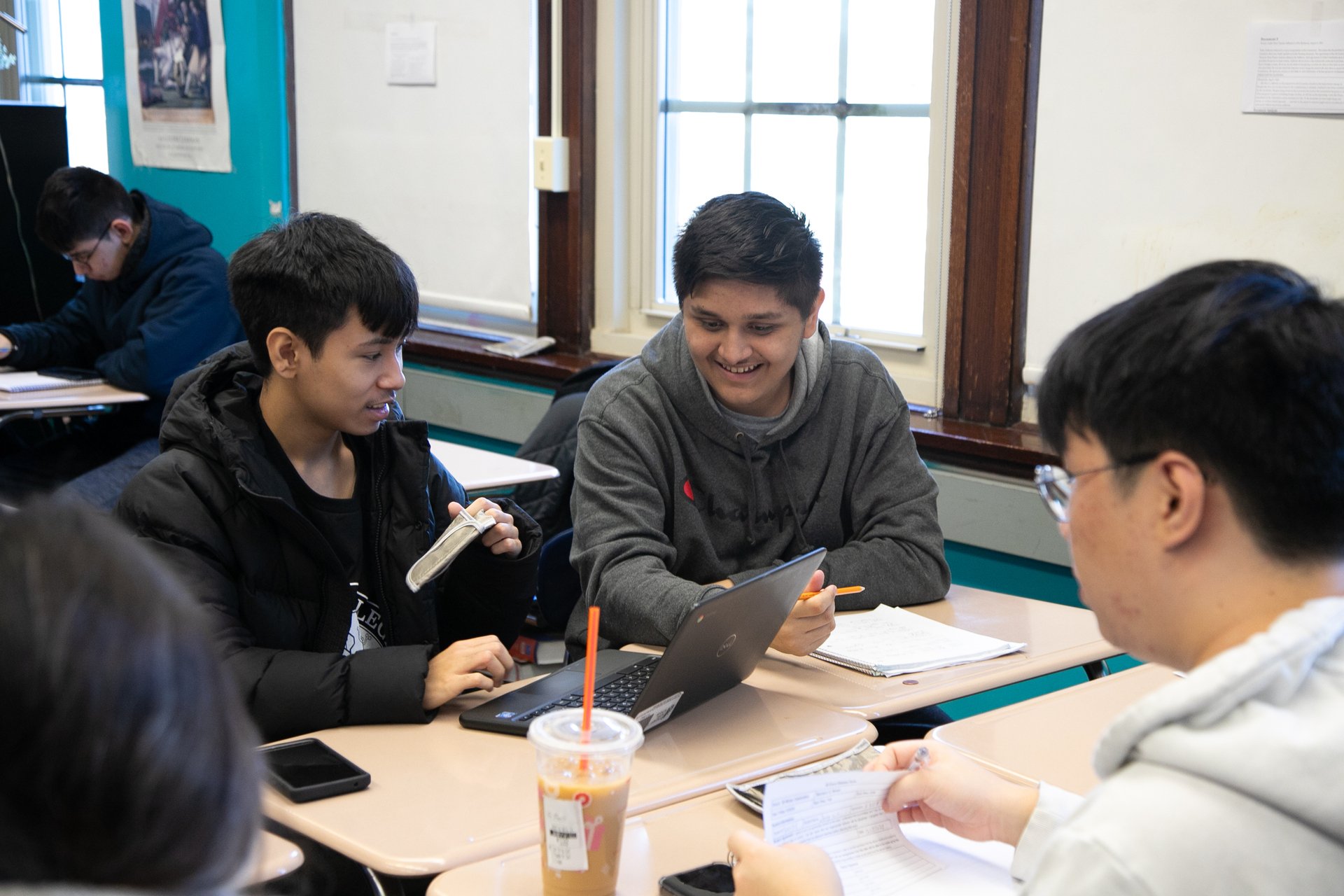 Students working together at a desk