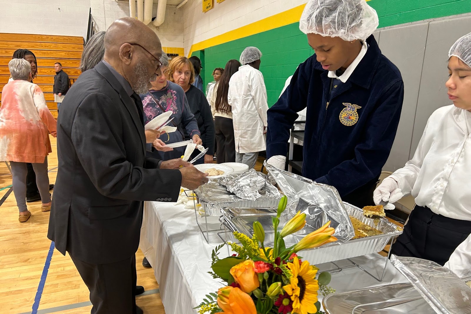 Chicago High School for Agricultural Sciences students serving a meal