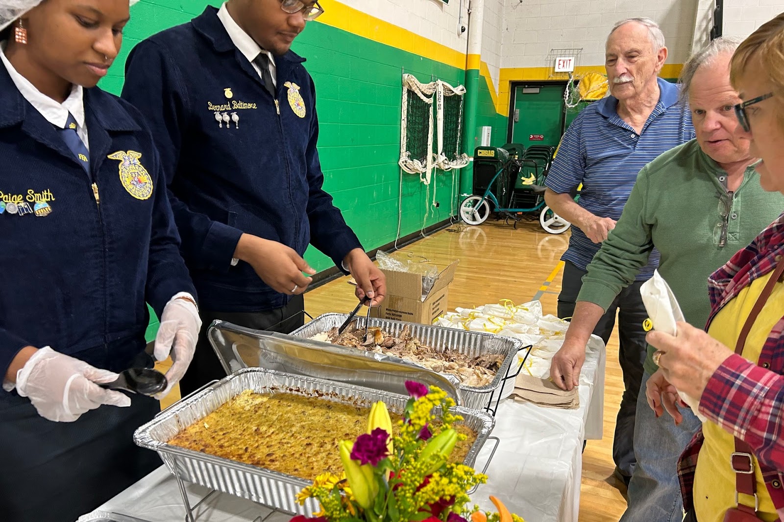 image of students serving the meal