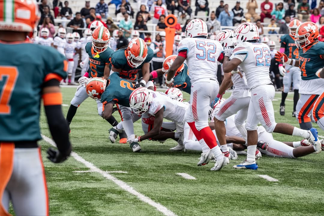 image of running back being tackled after a short gain