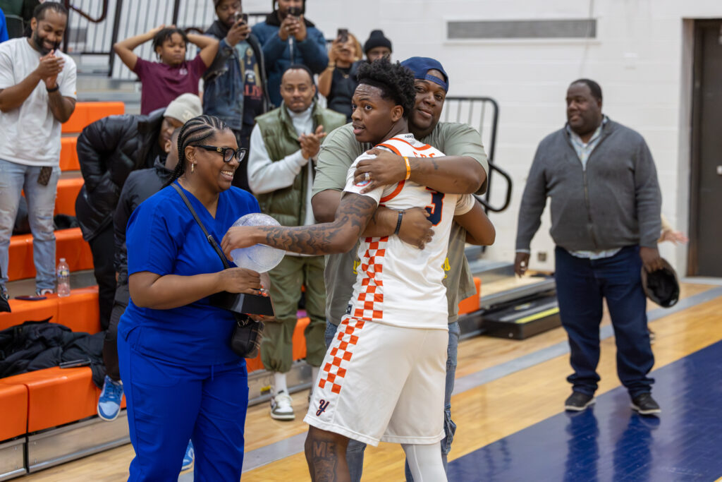 basketball player getting a hug