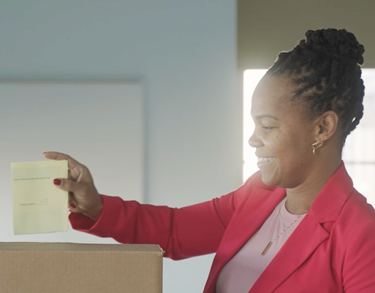 A parent votes in her LSC election