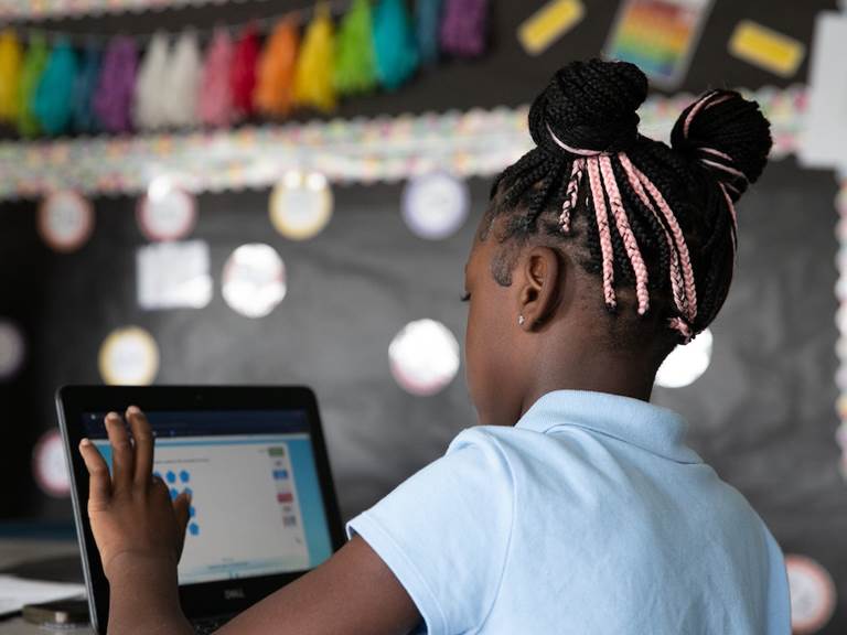 A CPS student uses technology in the classroom.