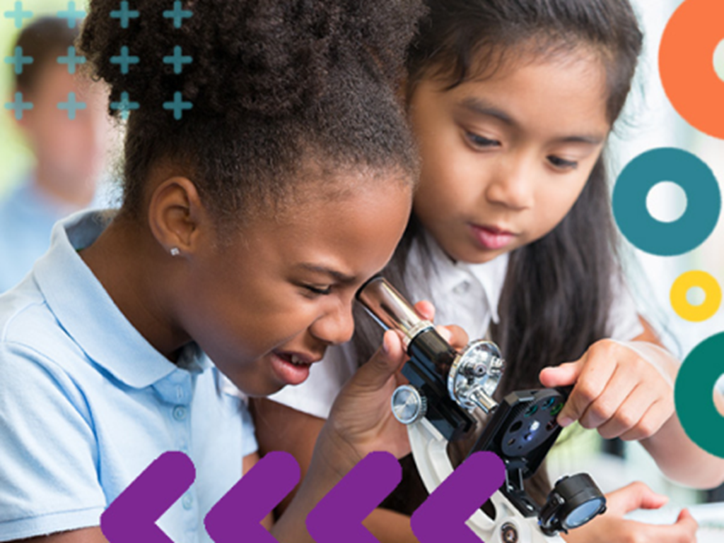 Children looking through a microscope