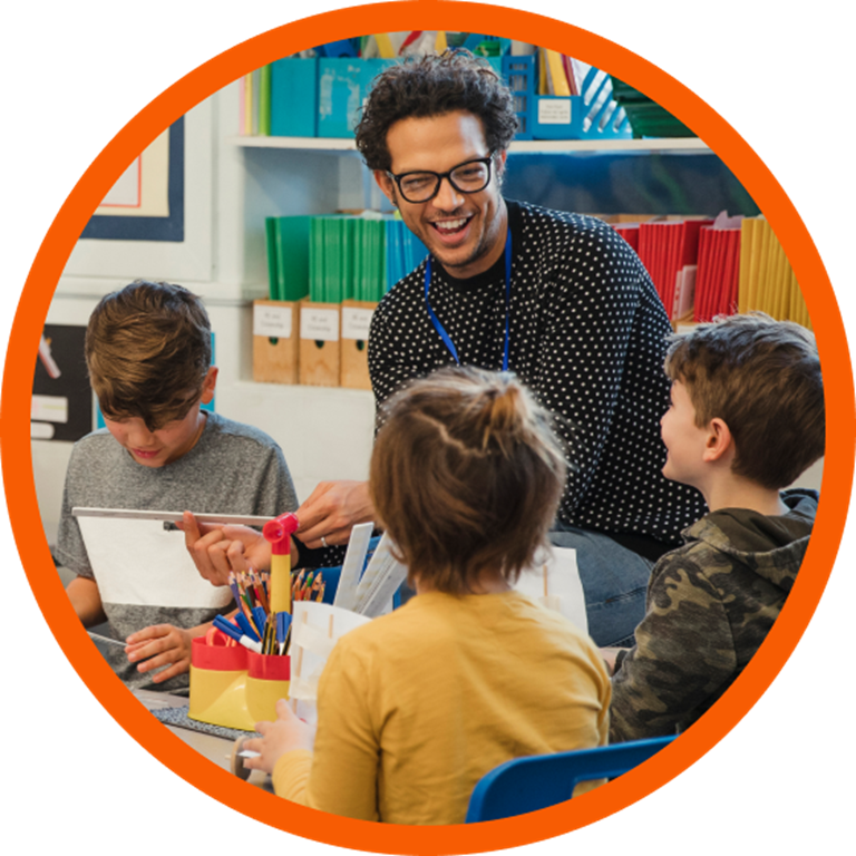 Teacher teaching a group of young students