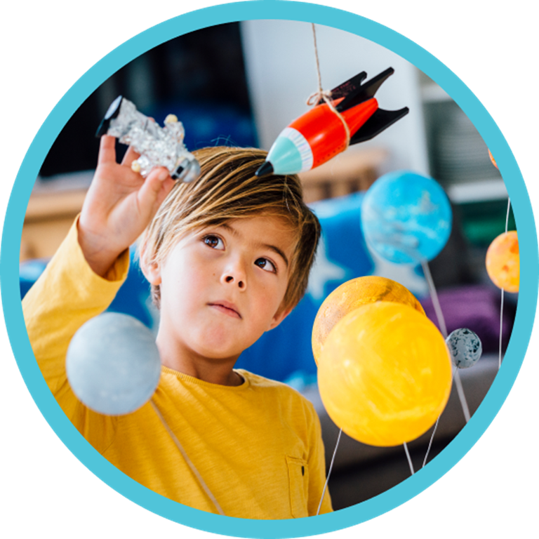 Kid playing with science toys