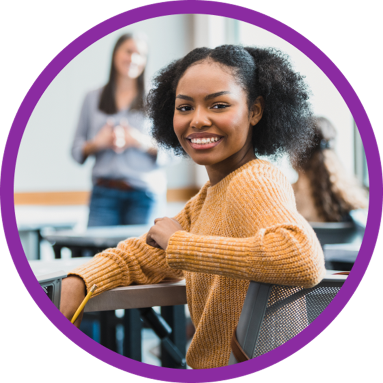 Smiling student in a classroom