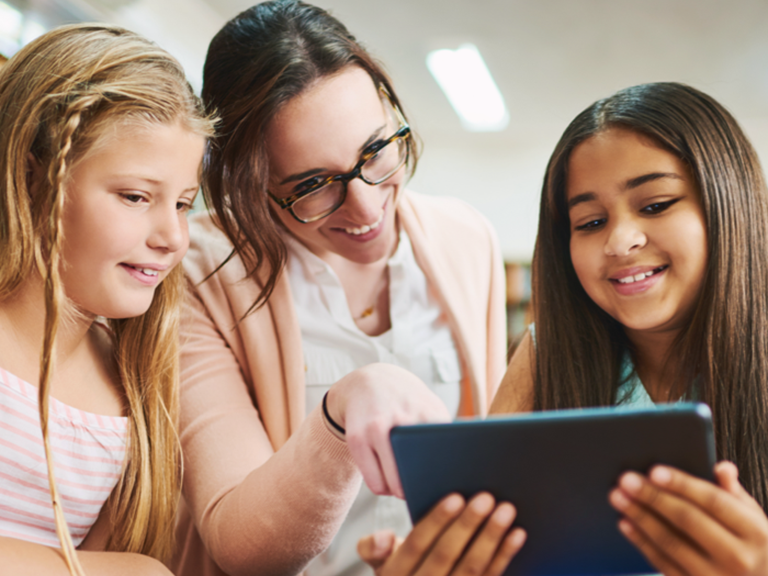 A family uses a tablet device