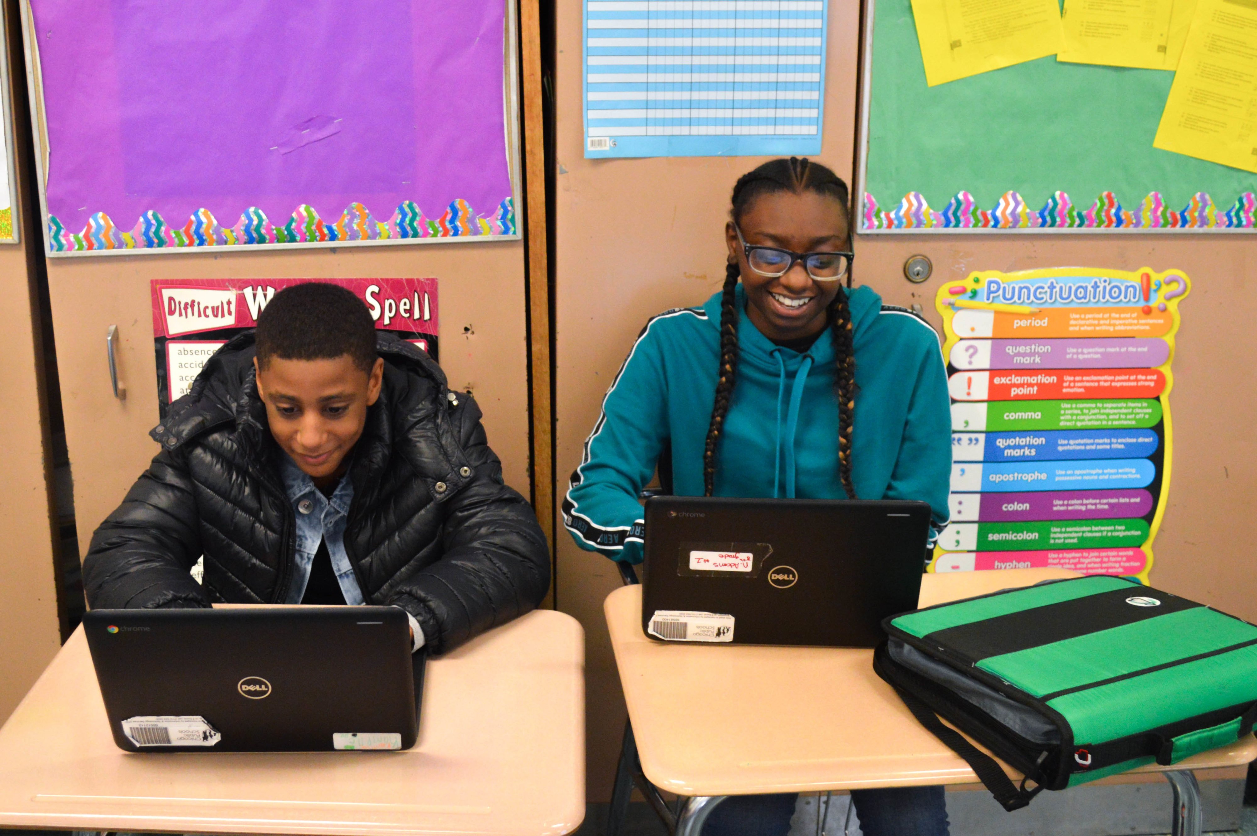 Classmates Malik T. (Left) and Nasjé A. (Right) Work on Research Papers