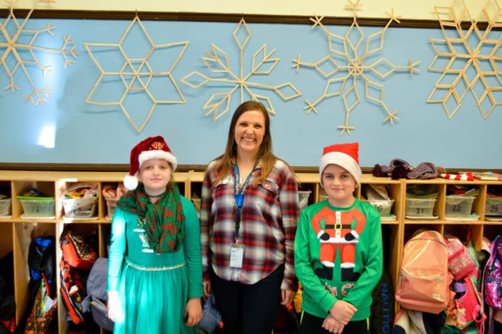Students and teacher wearing festive clothing