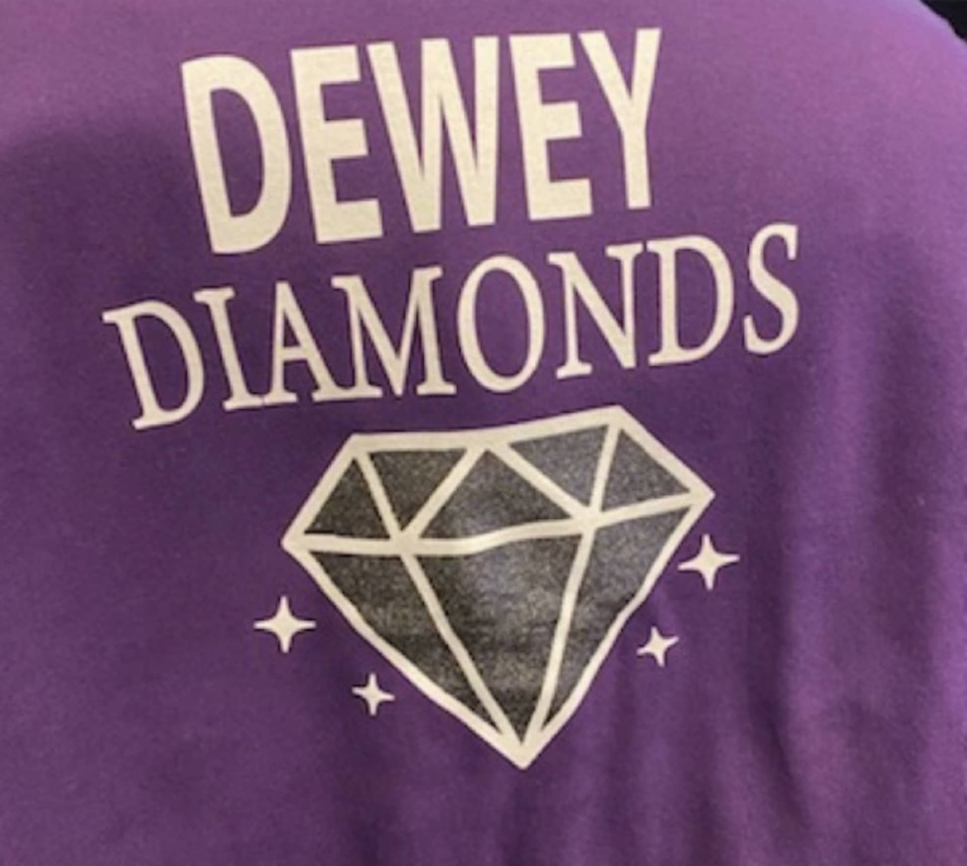A shirt with Dewey Diamonds written on it