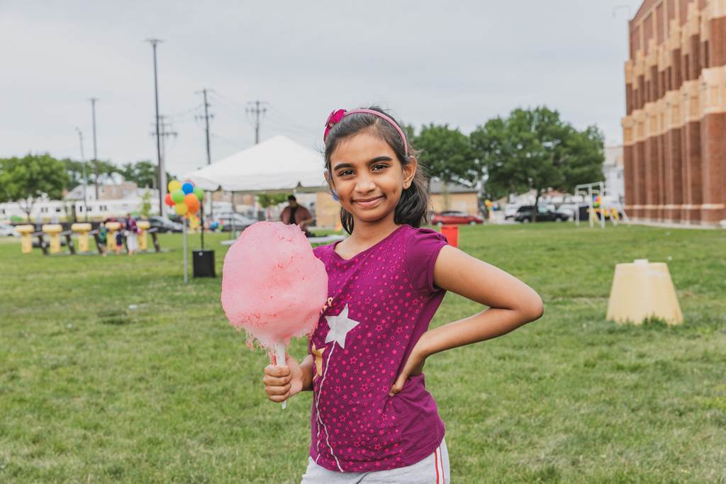 A girl eating cotton candy