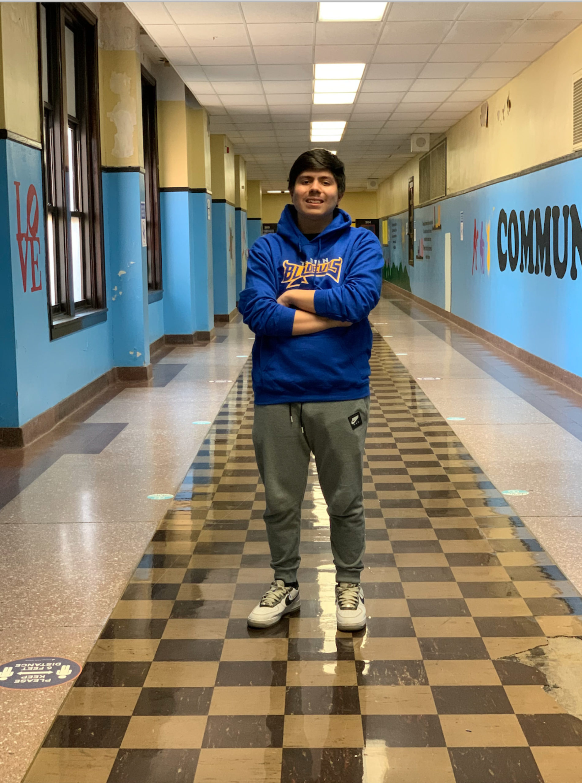 Roberto Gonzalez standing in a hallway