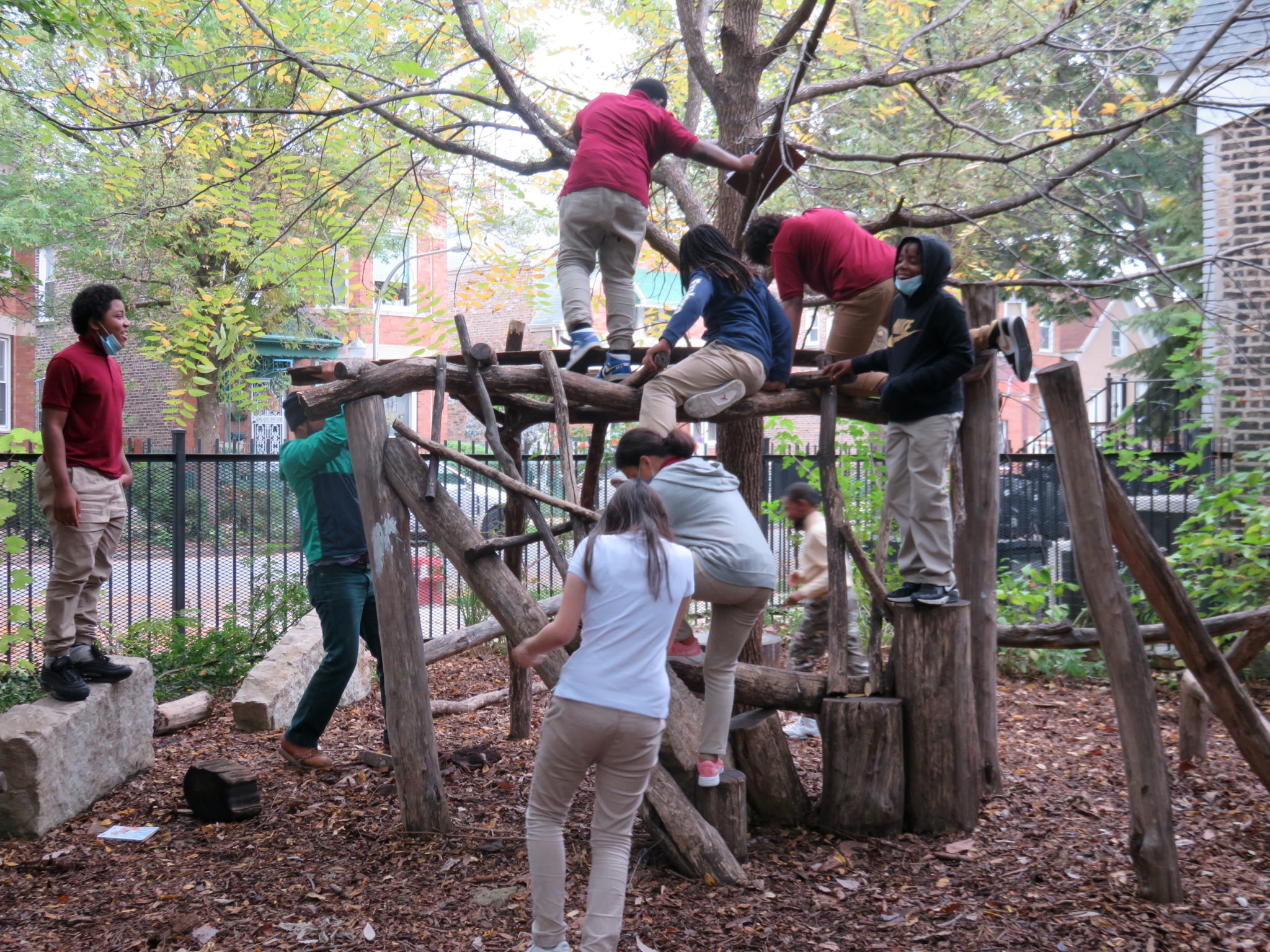 Group of students playing on a hand-made playground